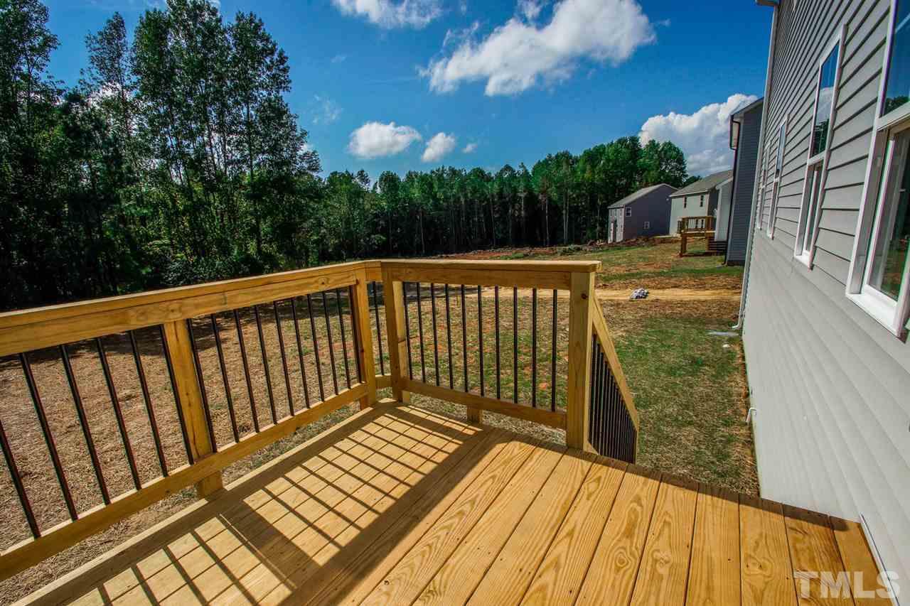 1128 Silver Farm Road Raleigh, NC 27603 - Photo 22 of 25 a view of balcony with wooden floor and fence