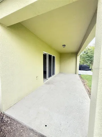 a view of a big room with windows