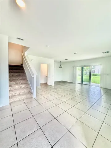 a view of entryway and kitchen