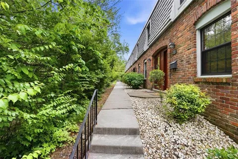 a view of a pathway both side of the house