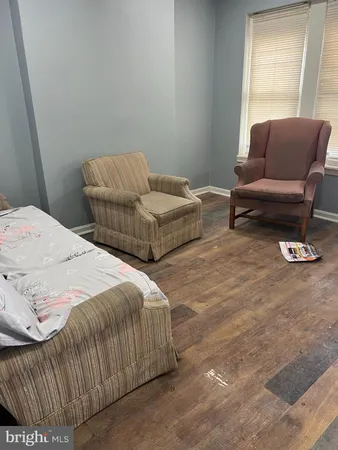 a bedroom with a bed and couch