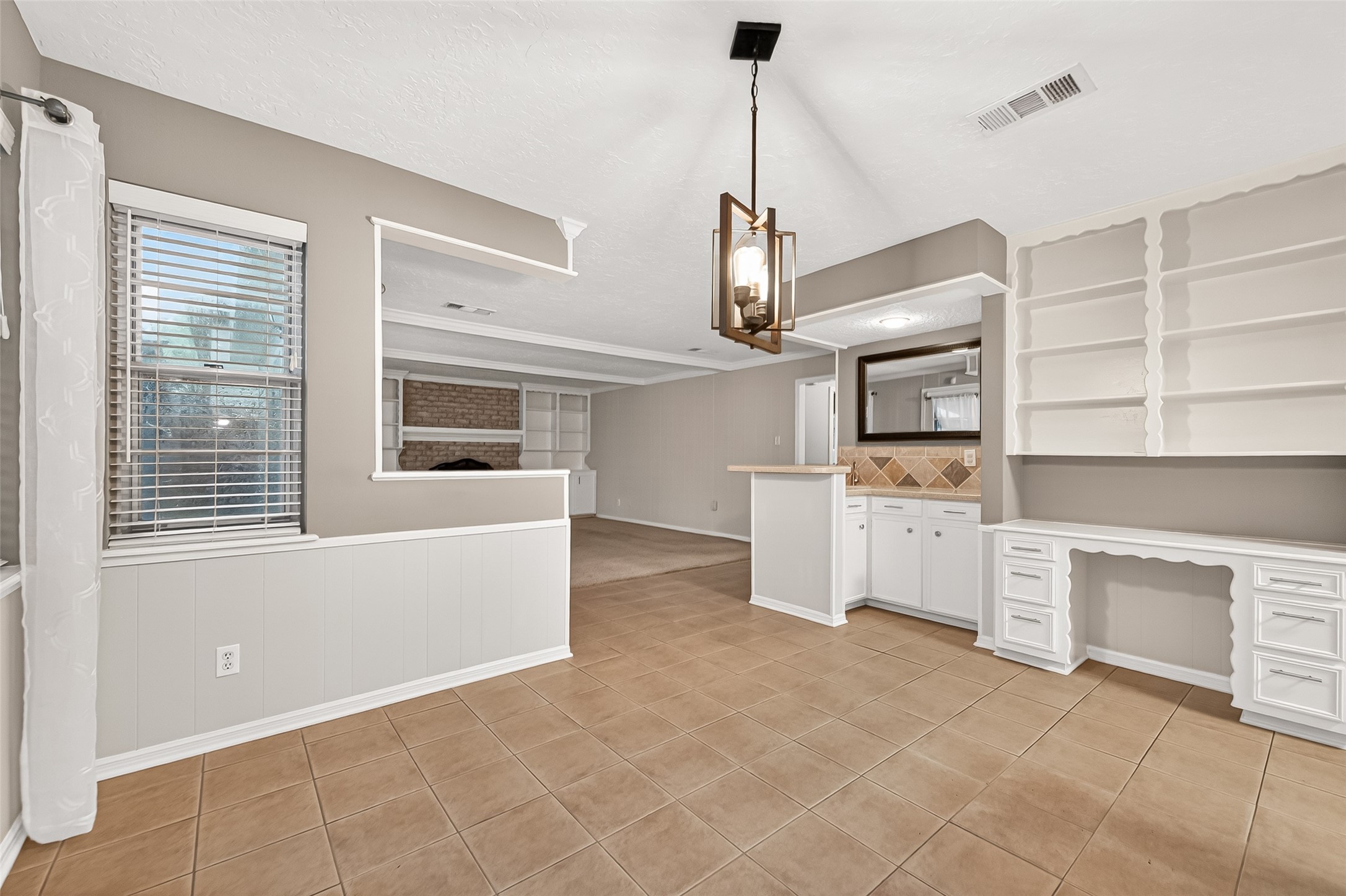 17810 Abby Lane Spring, TX 77379 - Photo 12 of 50 Breakfast Room with wet bar and Built in desk and shelves
