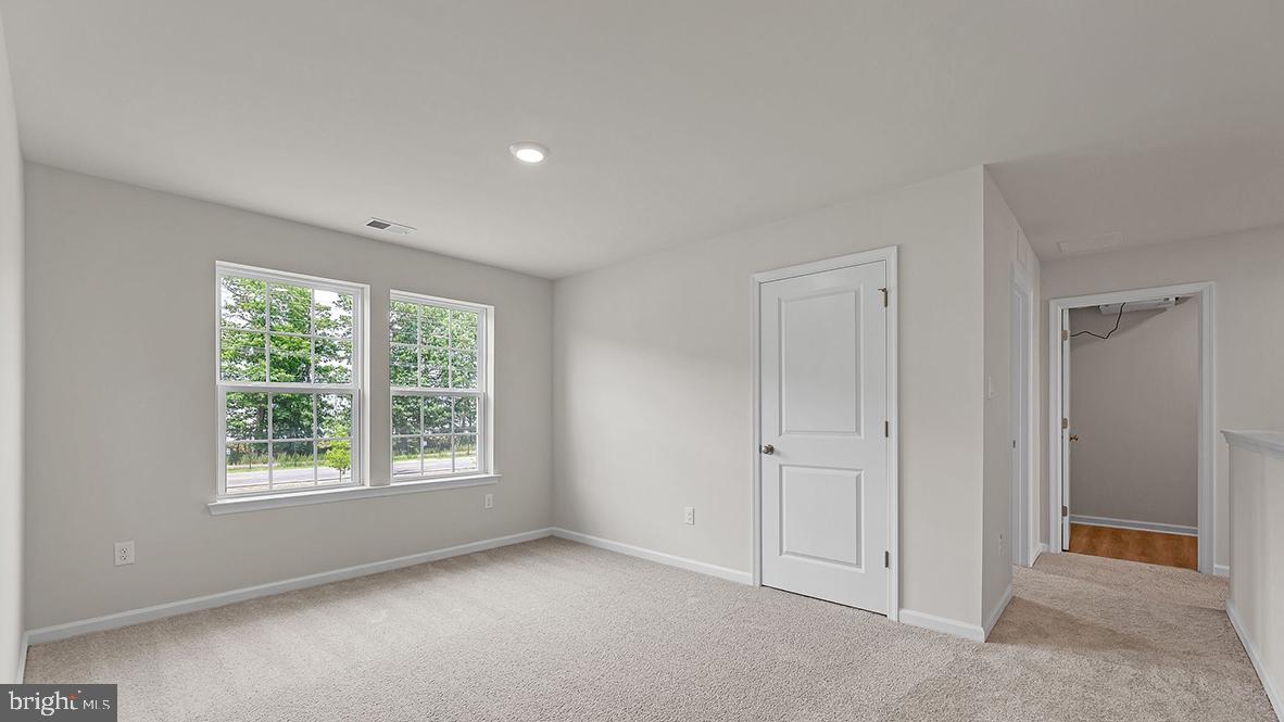 155 Littleworth Road Manahawkin, NJ 08050 - Photo 19 of 32 an empty room with windows and closet