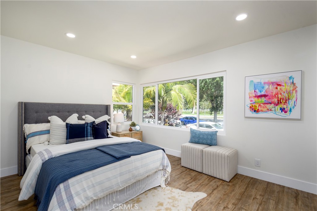 2531 North Studebaker Road Long Beach, CA 90815 - Photo 11 of 34 a bedroom with a large bed and a couch