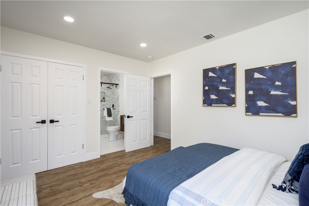 2531 North Studebaker Road Long Beach, CA 90815 - Photo 12 of 34 a bedroom with a bed and cabinets