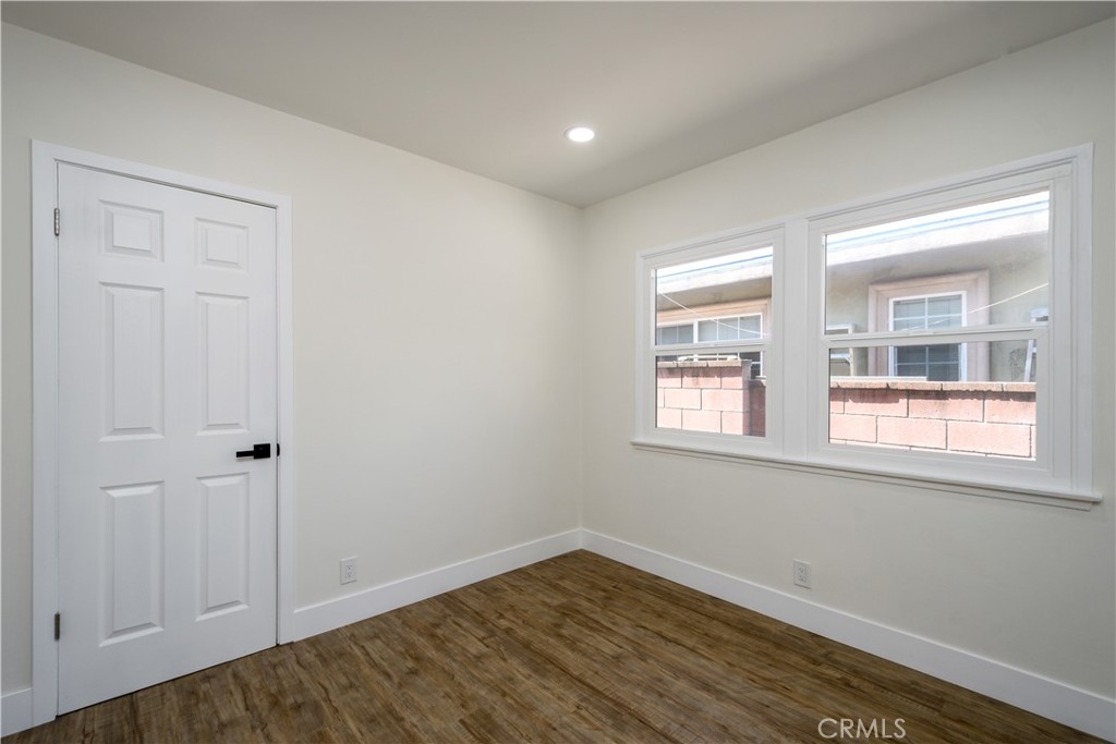 2531 North Studebaker Road Long Beach, CA 90815 - Photo 14 of 34 an empty room with wooden floor and windows
