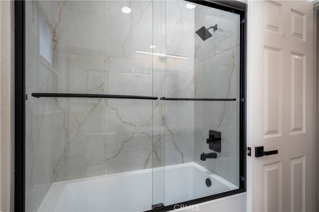2531 North Studebaker Road Long Beach, CA 90815 - Photo 16 of 34 a bathroom with a bath tub and a shower