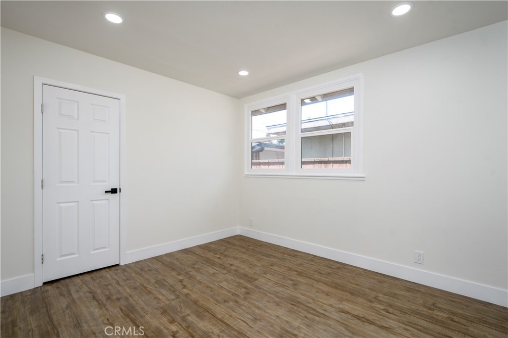 2531 North Studebaker Road Long Beach, CA 90815 - Photo 17 of 34 a view of empty room with wooden floor and fan
