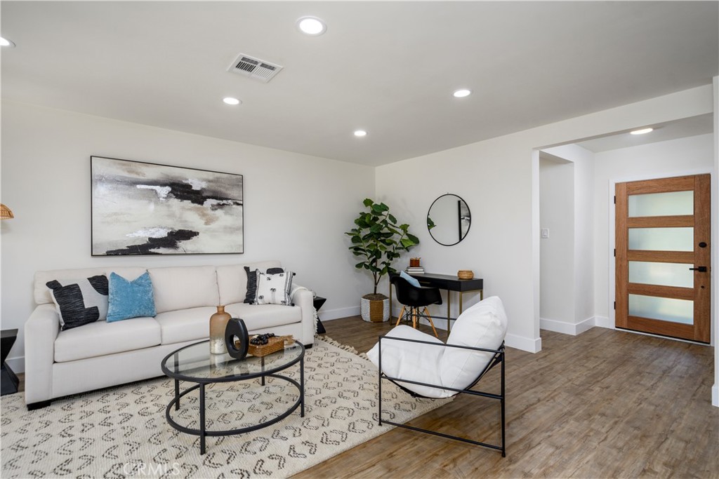 2531 North Studebaker Road Long Beach, CA 90815 - Photo 2 of 34 a living room with furniture a rug and a table
