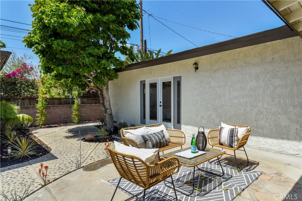 2531 North Studebaker Road Long Beach, CA 90815 - Photo 23 of 34 a view of a patio with couple of chairs and a fire pit