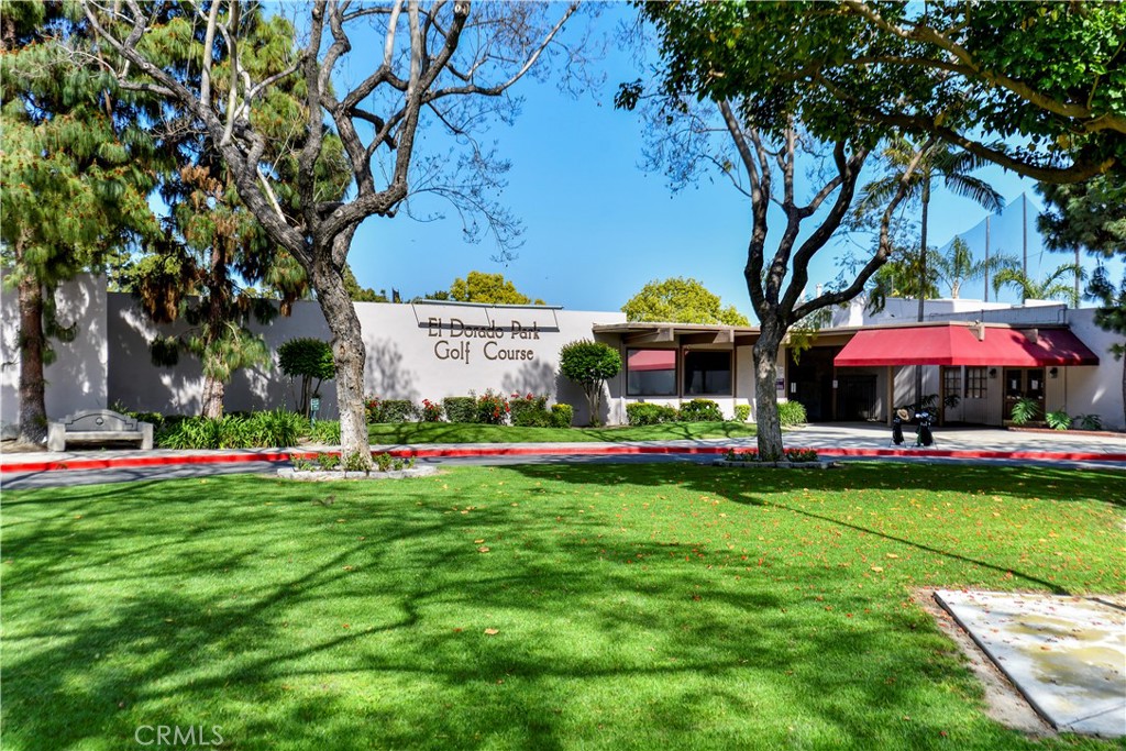 2531 North Studebaker Road Long Beach, CA 90815 - Photo 29 of 34 a view of a swimming pool with lawn chairs and a big yard