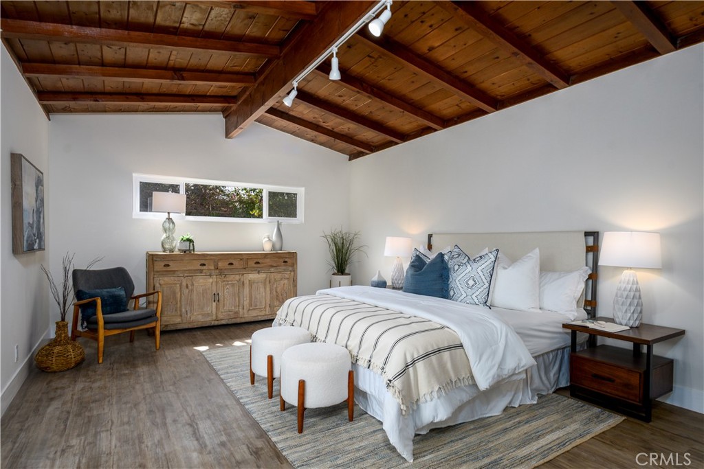 2531 North Studebaker Road Long Beach, CA 90815 - Photo 9 of 34 a bedroom with bed chair and window