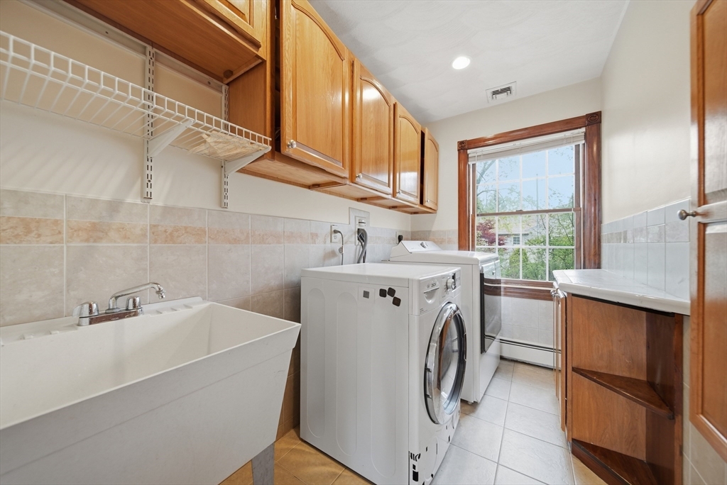 131 Range Heights Road Lynn, MA 01904 - Photo 20 of 36 a utility room with dryer and washer