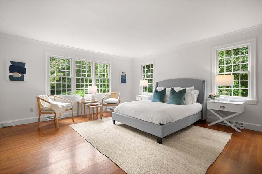 201 Smoke Valley Road Osterville, MA 02655 - Photo 23 of 48 a bedroom with a bed and a large window