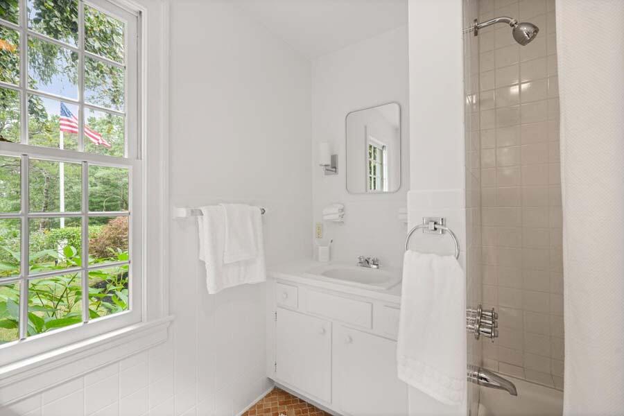201 Smoke Valley Road Osterville, MA 02655 - Photo 26 of 48 a bathroom with a bathtub and shower