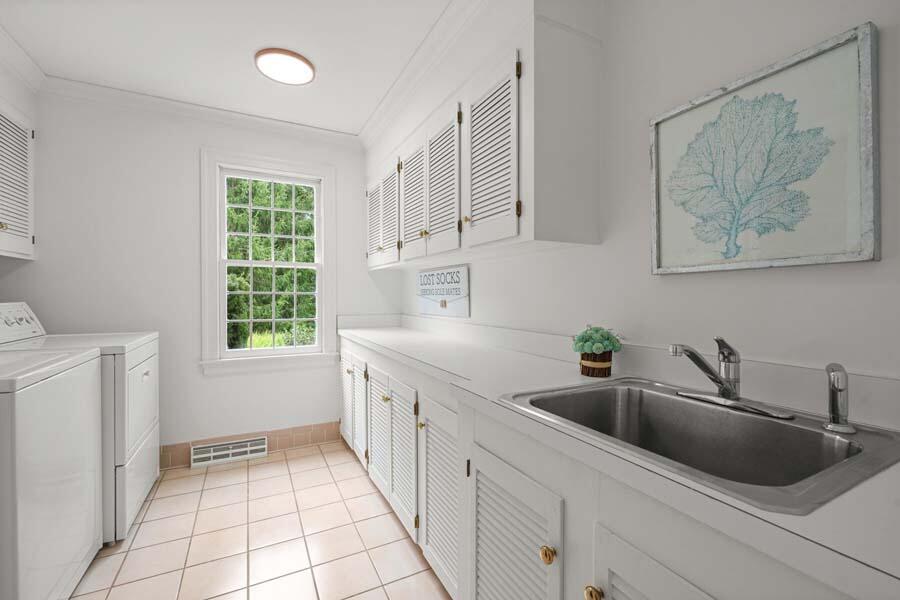 201 Smoke Valley Road Osterville, MA 02655 - Photo 42 of 48 a kitchen with a sink cabinets and window
