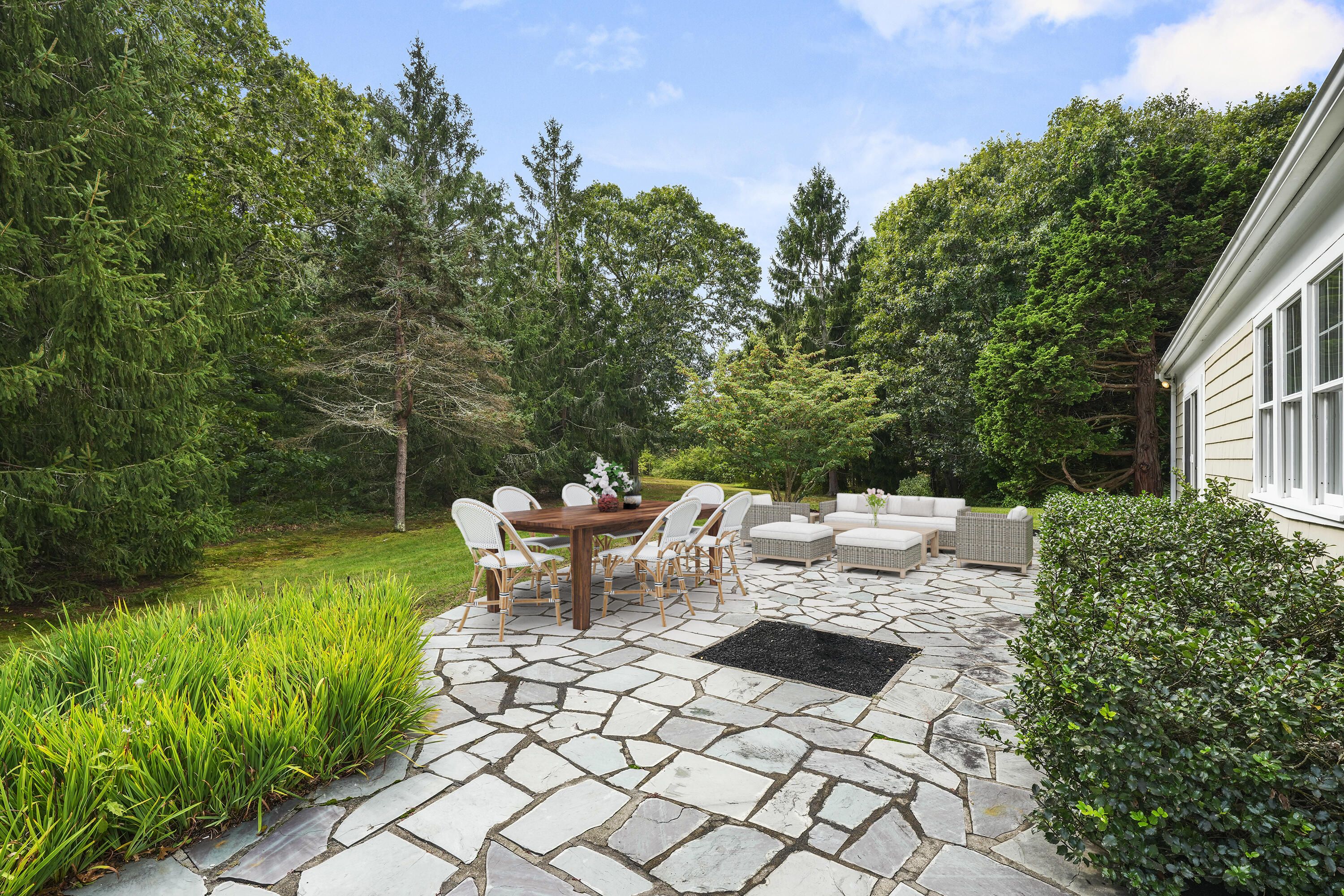 201 Smoke Valley Road Osterville, MA 02655 - Photo 48 of 48 a view of a patio with table and chairs and potted plants