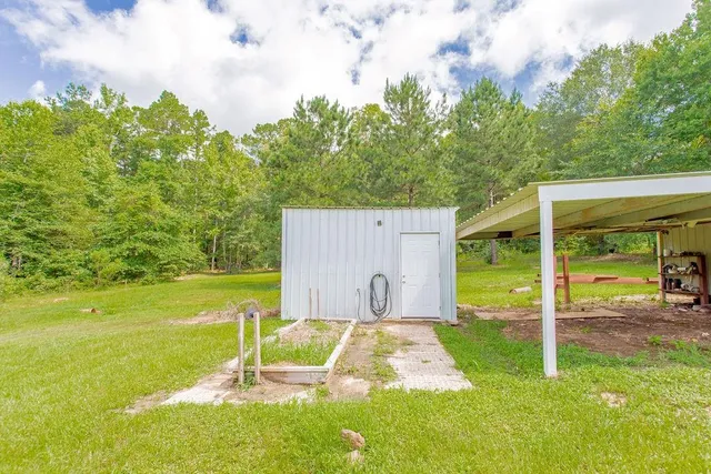 a view of a backyard with swimming pool