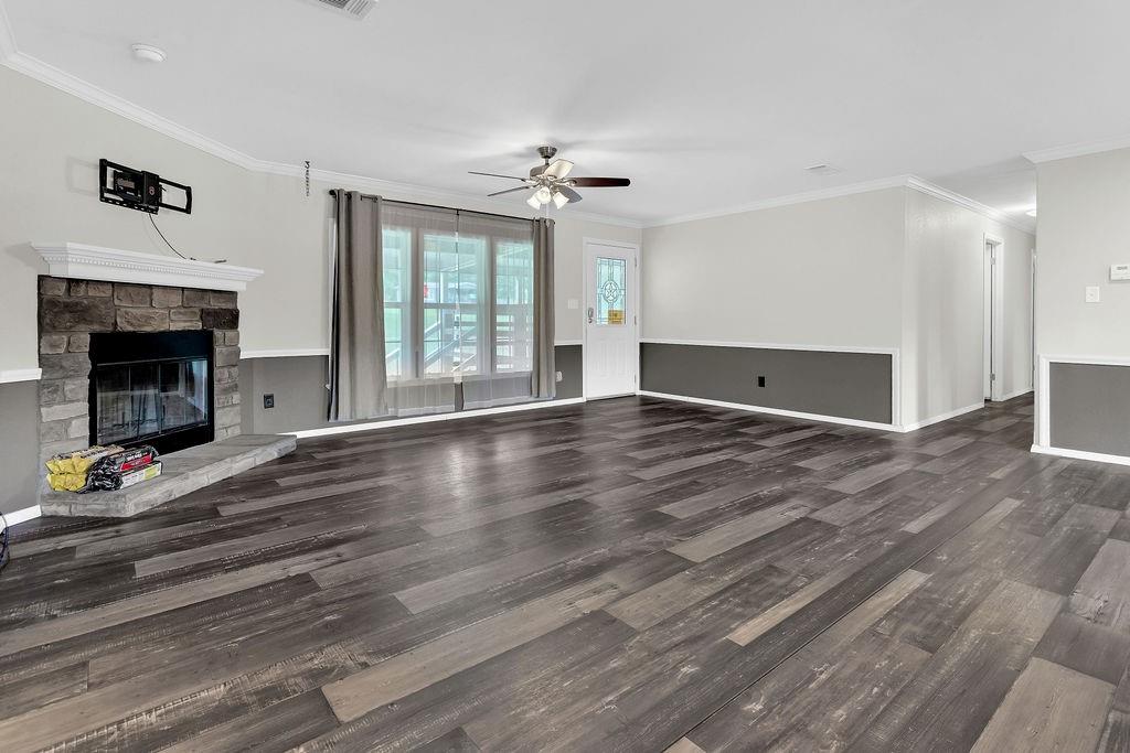 636 Roberson Road Hallsville, TX 75650 - Photo 17 of 36 a living room with hard wood floors and fireplace