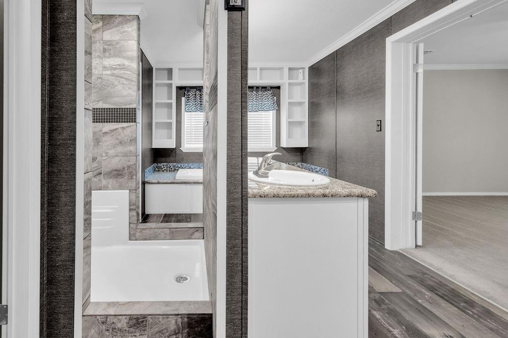636 Roberson Road Hallsville, TX 75650 - Photo 29 of 36 a bathroom with a granite countertop sink and a mirror