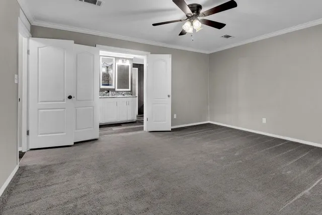 a bath tub sitting in a bathroom next to a window