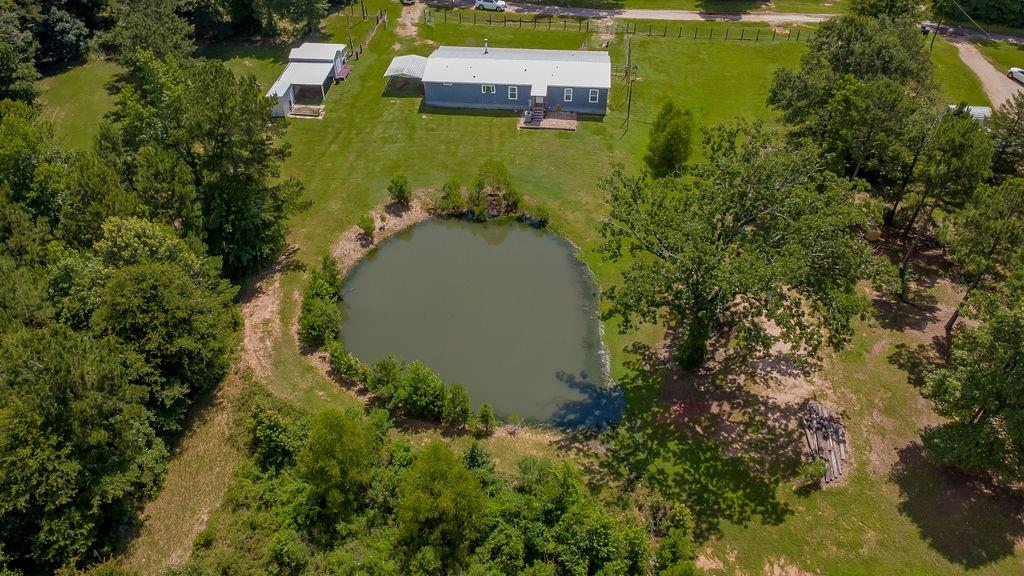 636 Roberson Road Hallsville, TX 75650 - Photo 7 of 36 an aerial view of residential house with outdoor space and trees all around