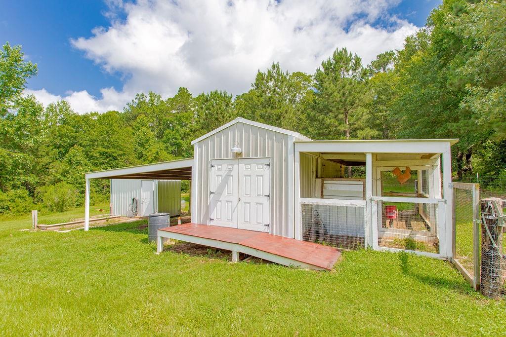 636 Roberson Road Hallsville, TX 75650 - Photo 10 of 36 a backyard of a house with table and chairs