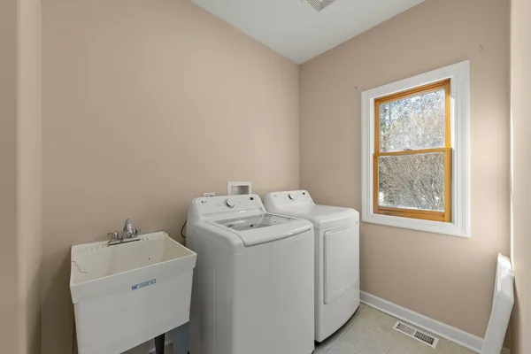 a utility room with dryer and washer