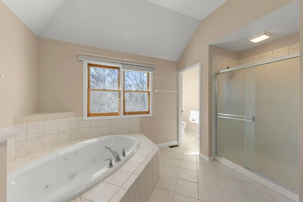 a bathroom with a bathtub and shower