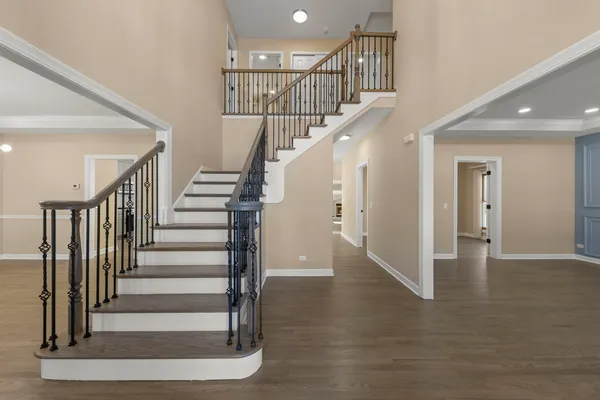 a view of entryway with wooden floor