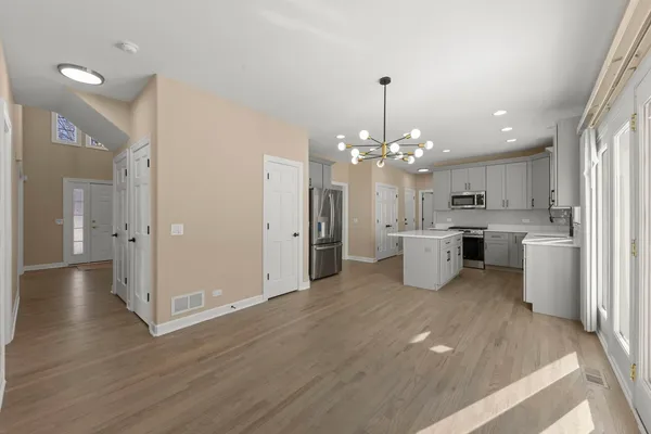 a view of a kitchen with a sink wooden floor and a kitchen
