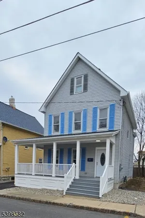 a view of a house with iron stairs