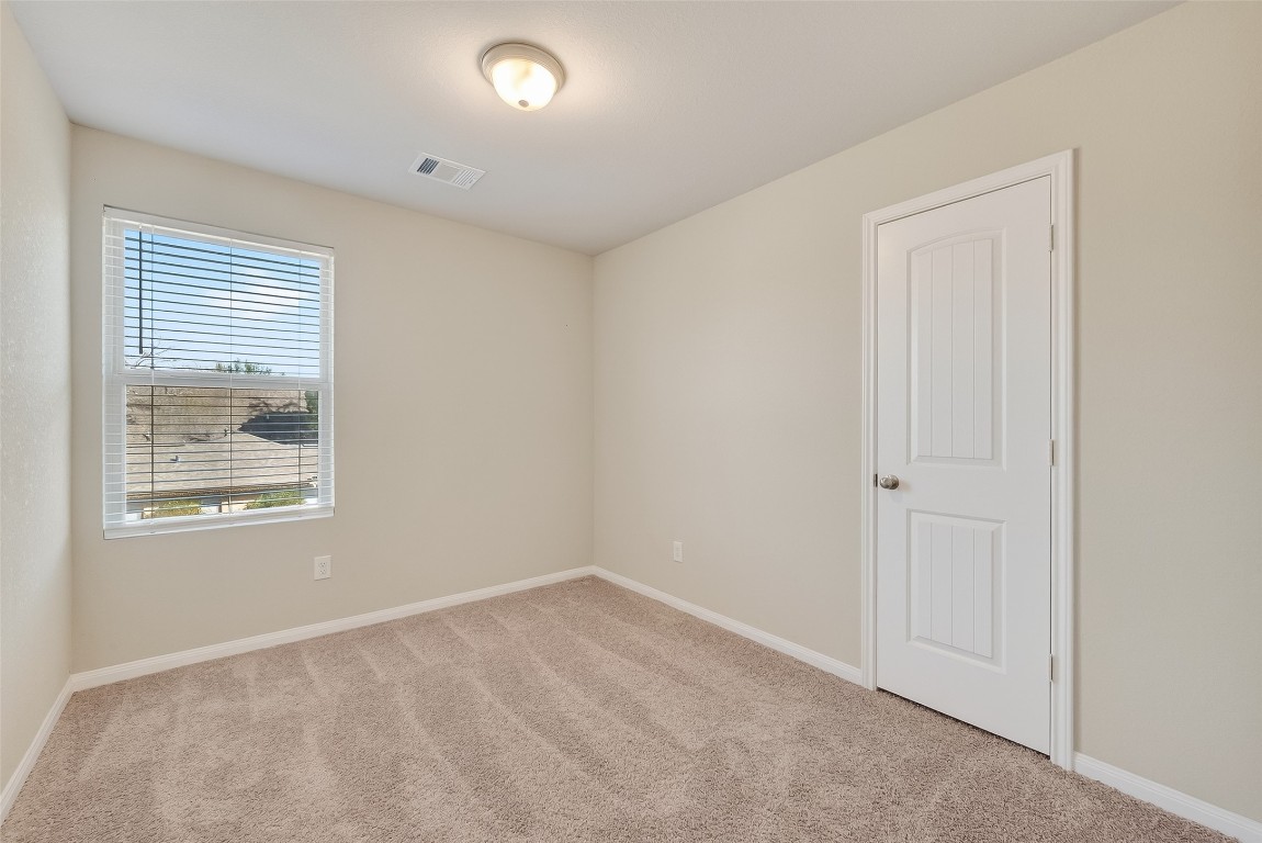 2516 Boss Street La Marque, TX 77568 - Photo 13 of 46 an empty room with windows