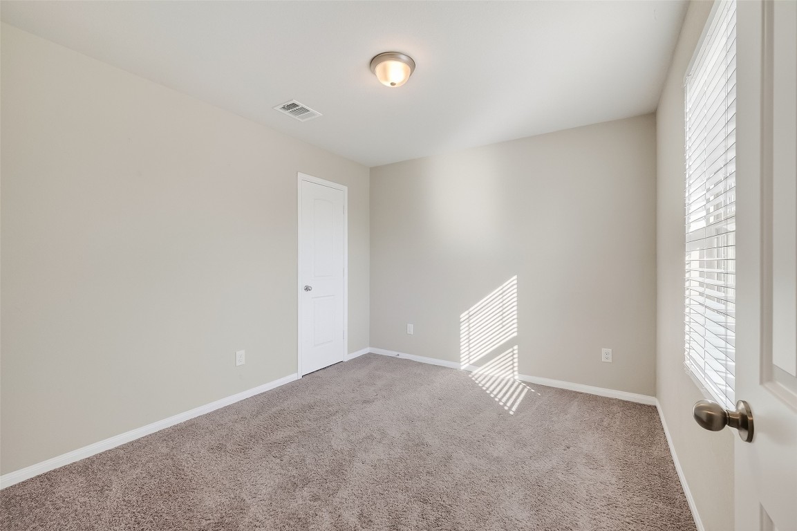 2516 Boss Street La Marque, TX 77568 - Photo 17 of 46 a view of an empty room with a window