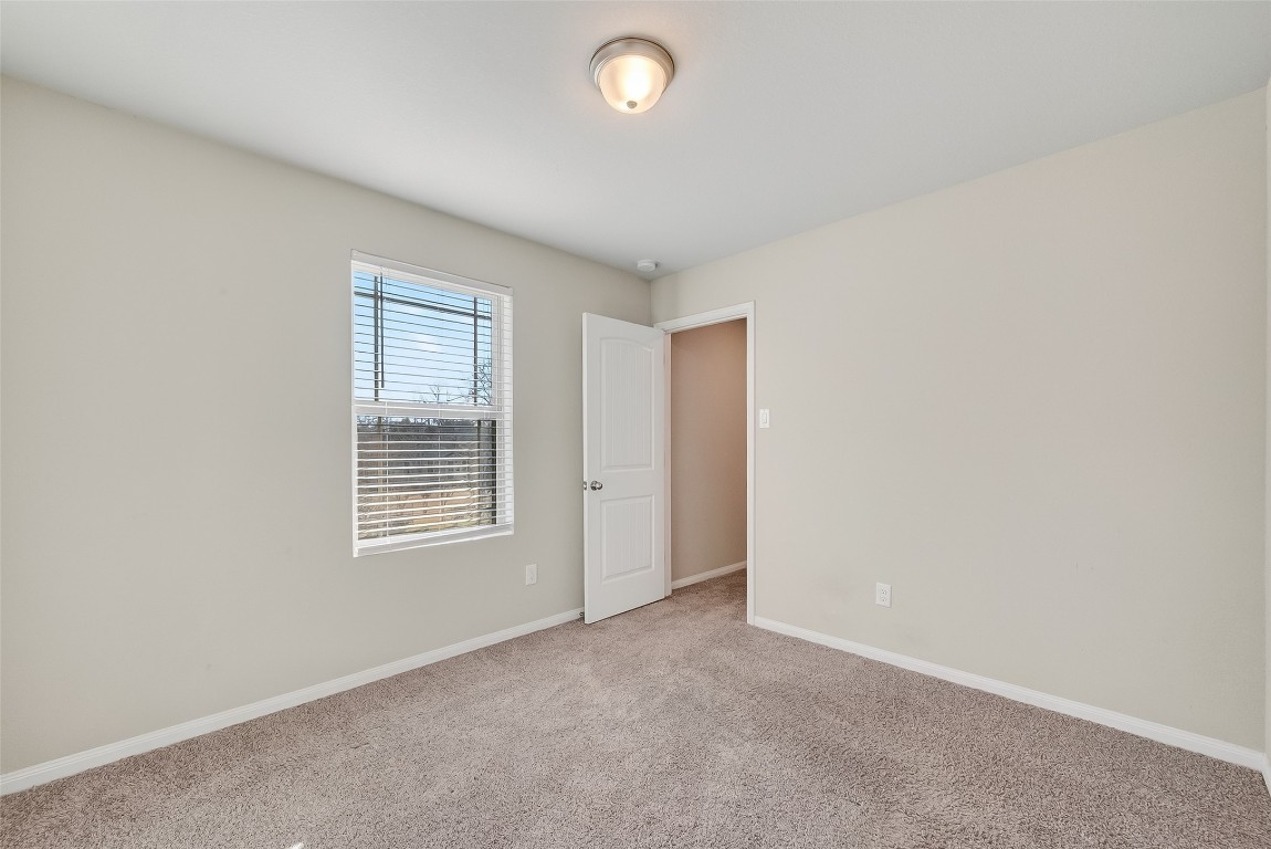2516 Boss Street La Marque, TX 77568 - Photo 19 of 46 an empty room with windows and closet