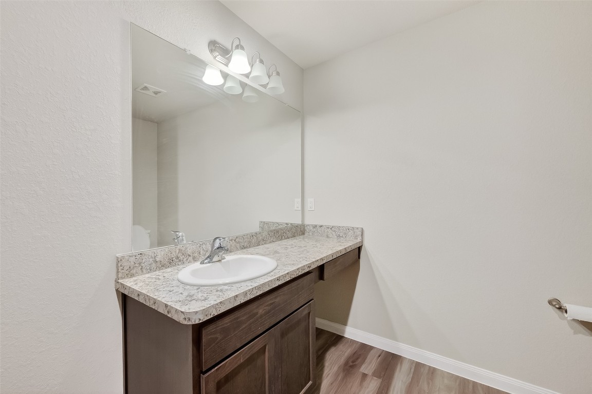 2516 Boss Street La Marque, TX 77568 - Photo 25 of 46 a sink and a mirror