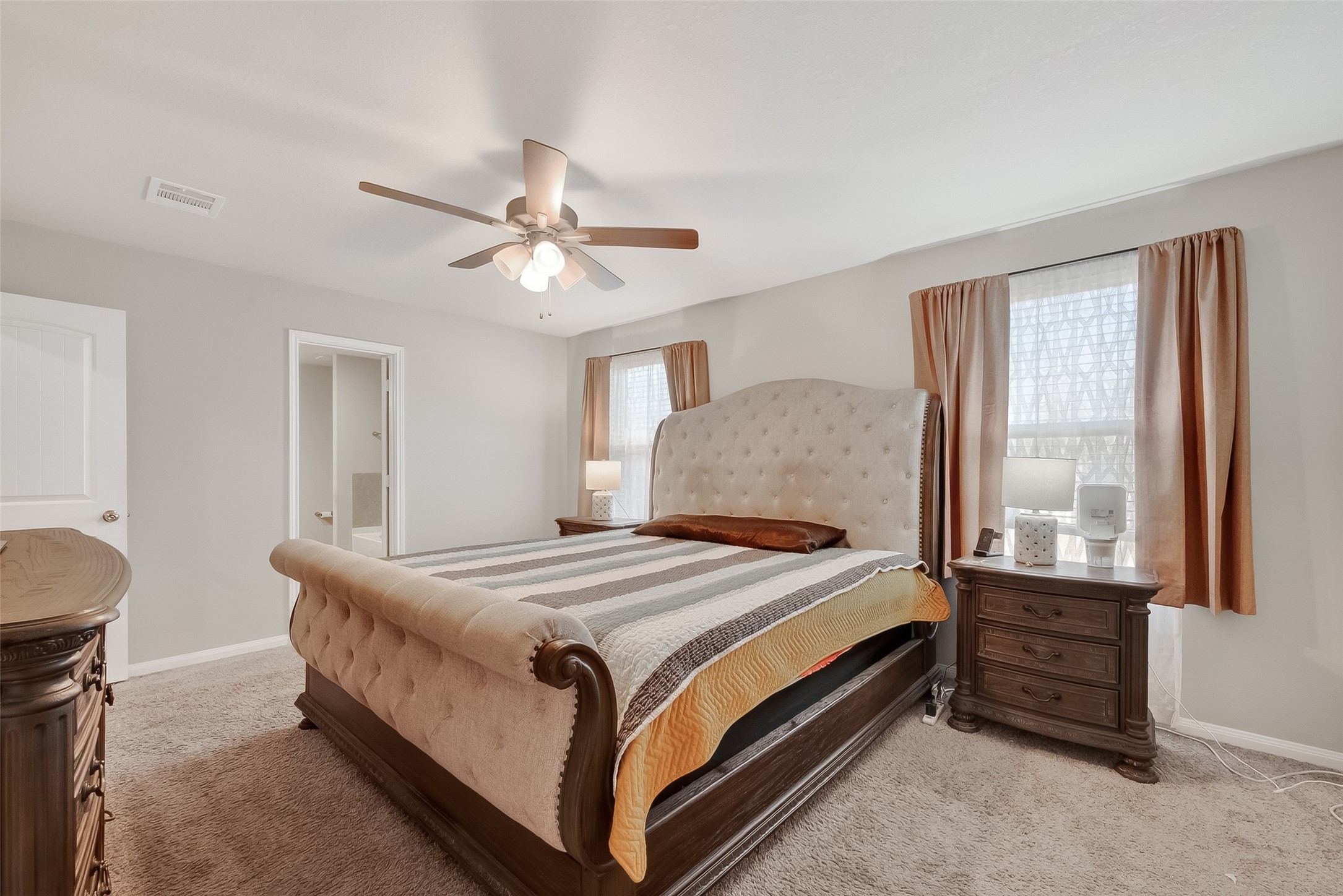 2516 Boss Street La Marque, TX 77568 - Photo 37 of 46 a bedroom with a bed lamp and a window