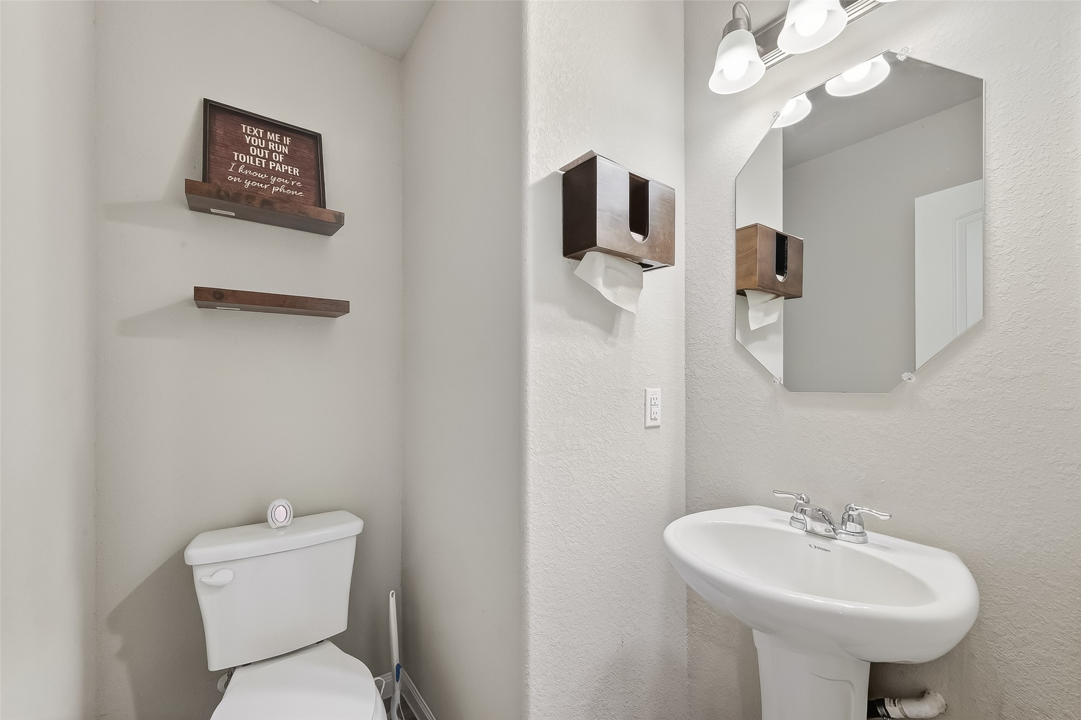 2516 Boss Street La Marque, TX 77568 - Photo 10 of 46 a bathroom with a toilet sink and mirror