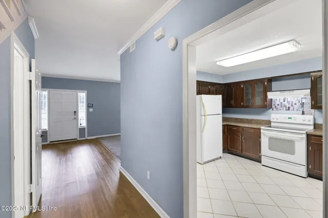 a spacious bathroom with a granite countertop sink and a mirror