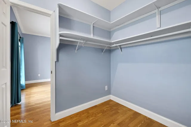 a view of a room with shelf on the wall