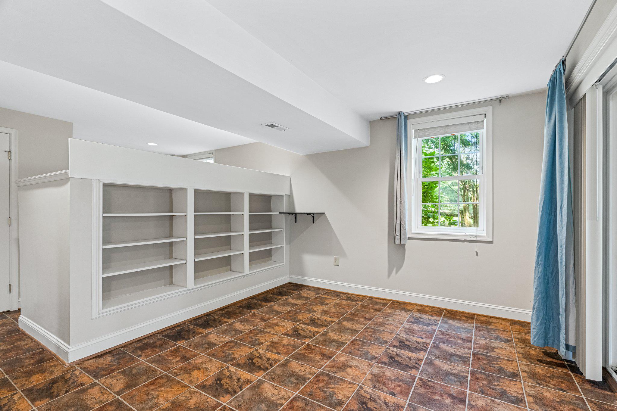 12400 Triple Crown Road Gaithersburg, MD 20878 - Photo 31 of 45 Lower Level Living Area with Built-in Shelves