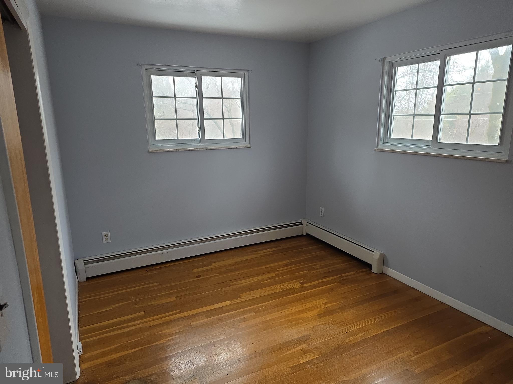 60 Carter Road Princeton, NJ 08540 - Photo 13 of 43 an empty room with wooden floor and windows