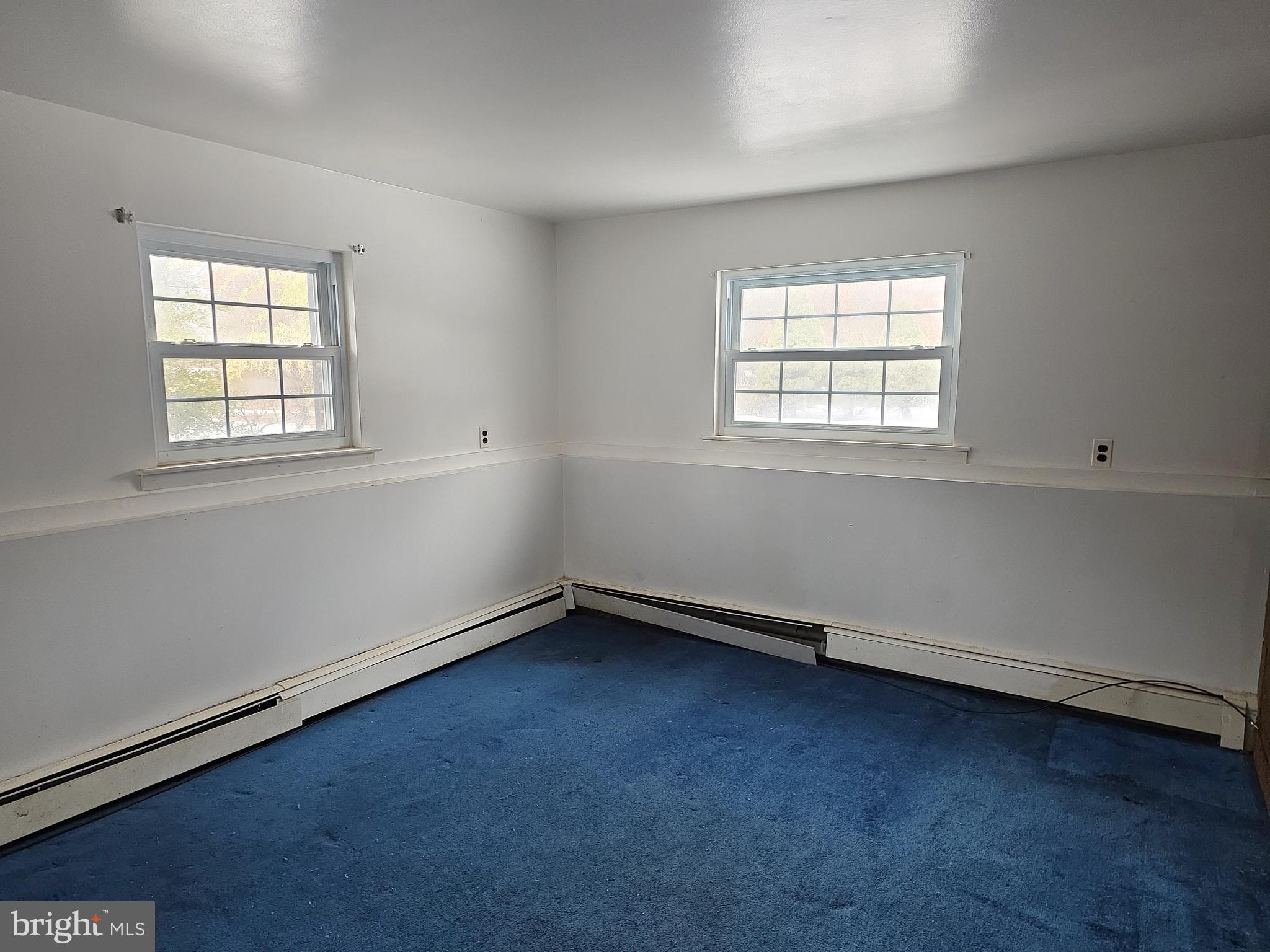 60 Carter Road Princeton, NJ 08540 - Photo 19 of 43 an empty room with wooden floor and windows