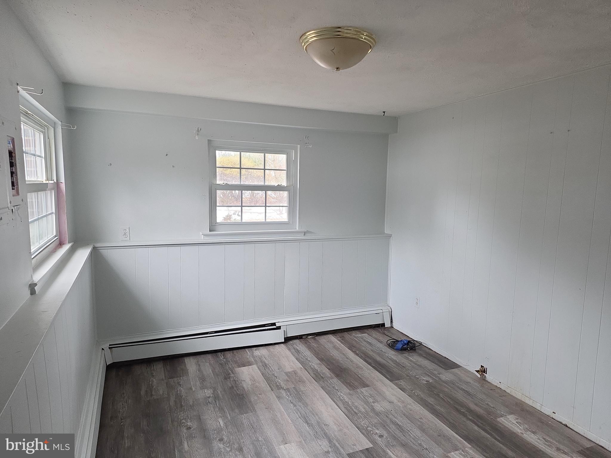 60 Carter Road Princeton, NJ 08540 - Photo 22 of 43 an empty room with wooden floor and windows
