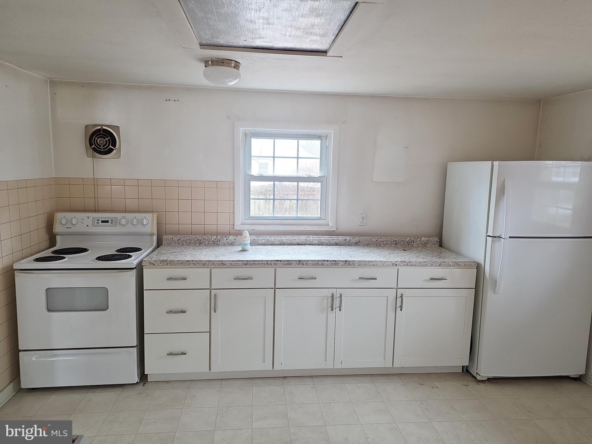 60 Carter Road Princeton, NJ 08540 - Photo 30 of 43 a kitchen with white cabinets sink and white appliances