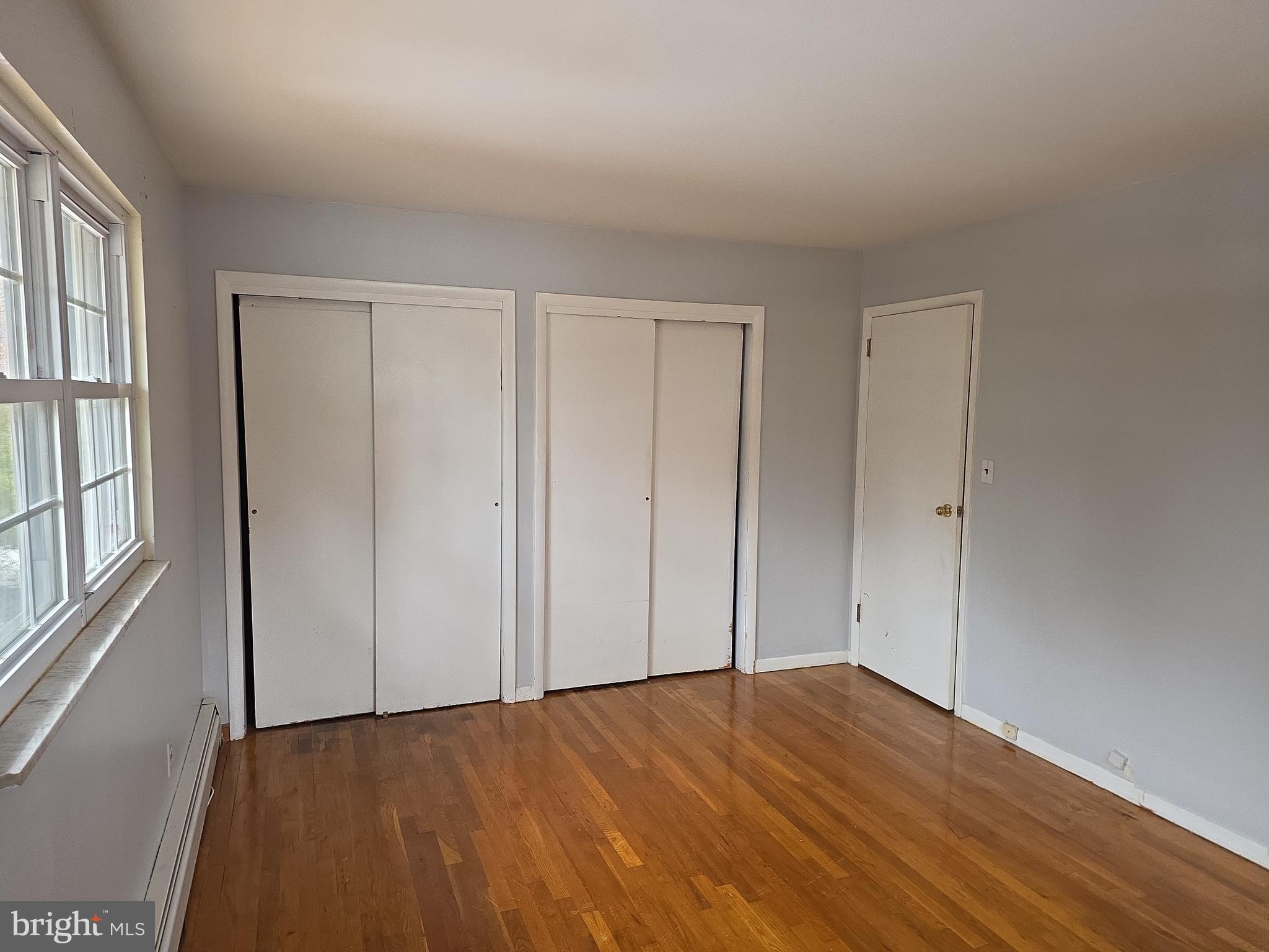 60 Carter Road Princeton, NJ 08540 - Photo 36 of 43 a view of an empty room with wooden floor and a window