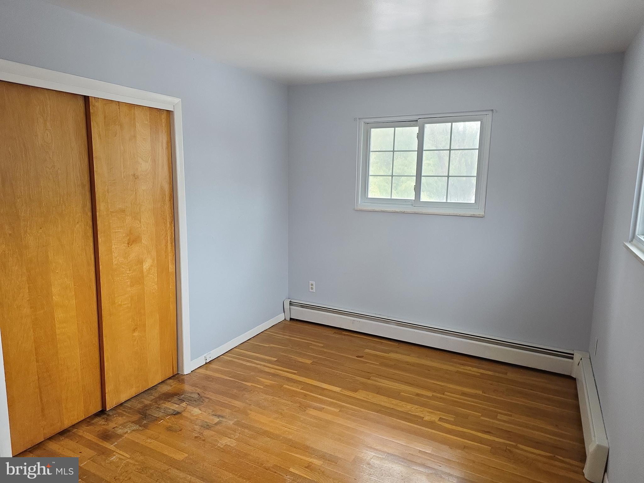 60 Carter Road Princeton, NJ 08540 - Photo 38 of 43 a view of an empty room with wooden floor and a window