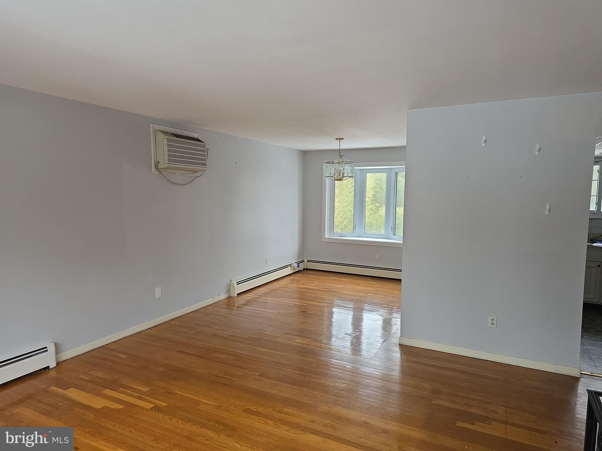 60 Carter Road Princeton, NJ 08540 - Photo 5 of 43 a view of an empty room with wooden floor and a window
