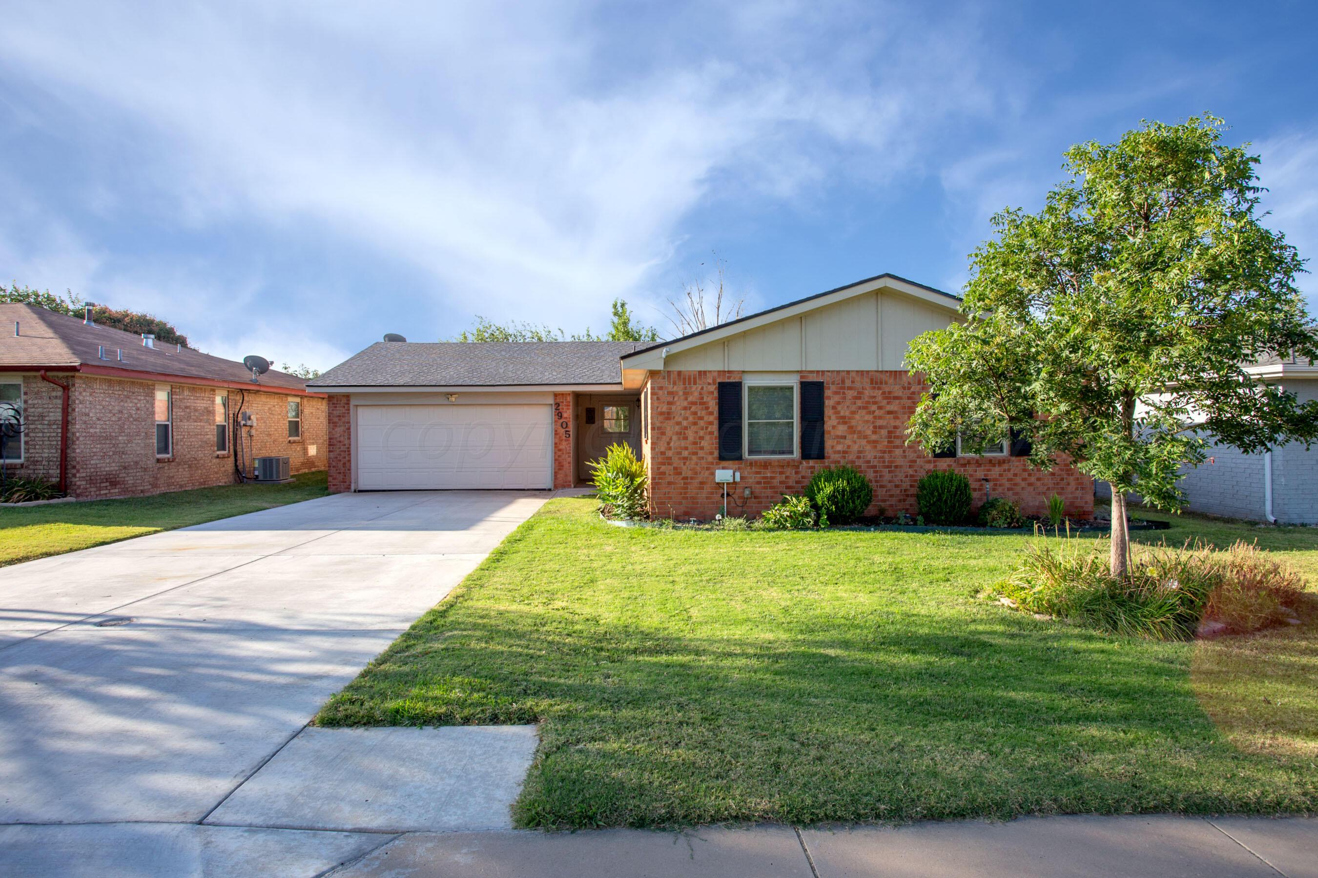2905 Salem Drive Amarillo, TX 79110 - Photo 1 of 29 a front view of a house with a yard and garage