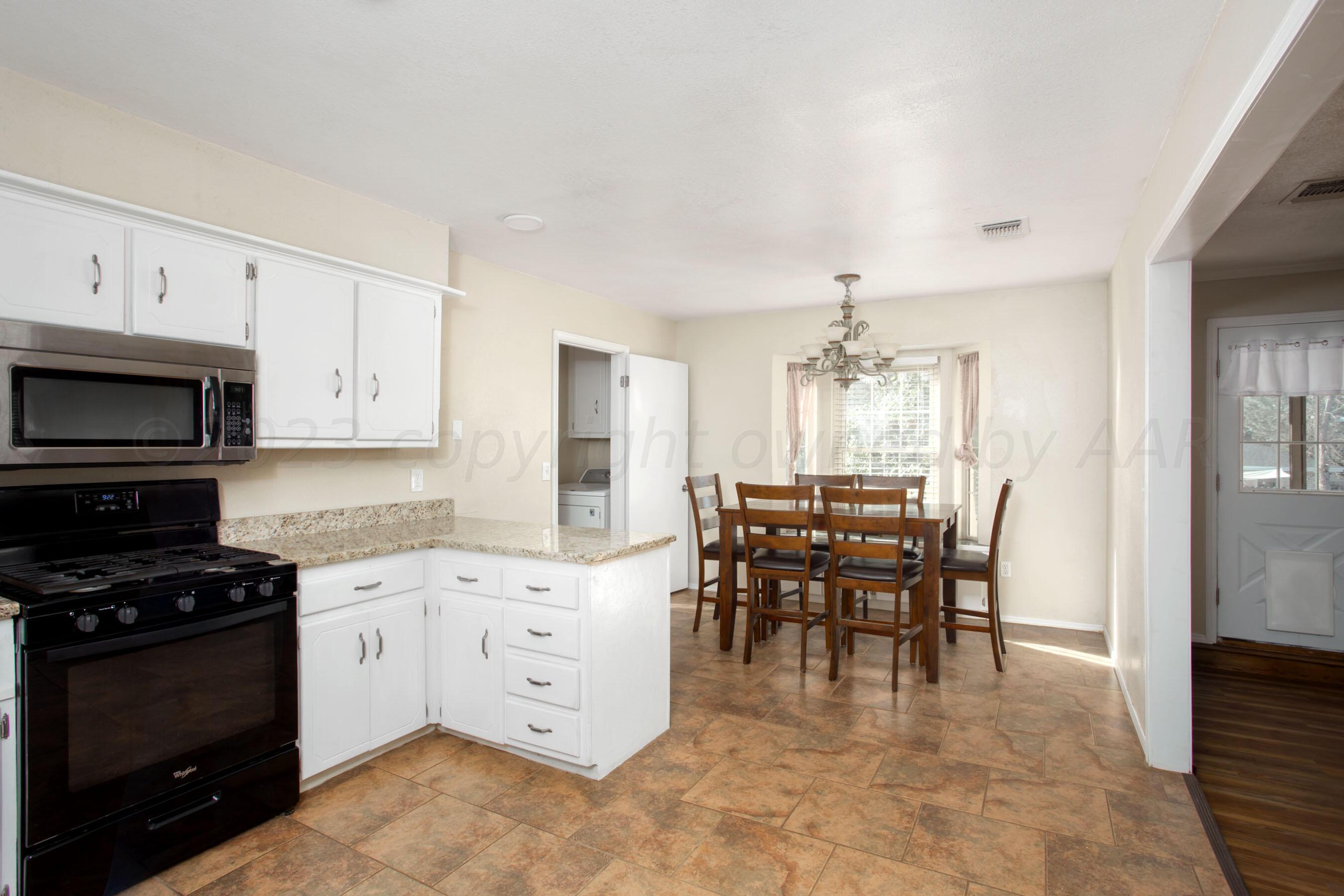 2905 Salem Drive Amarillo, TX 79110 - Photo 11 of 29 a view of a kitchen and dining room